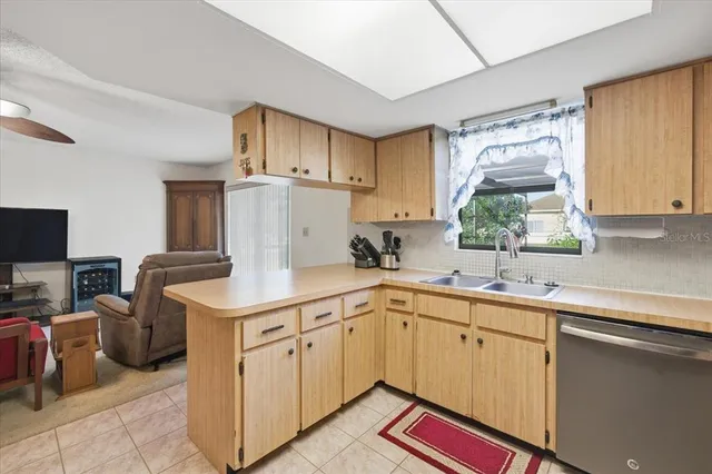 a kitchen with a sink cabinets and appliances