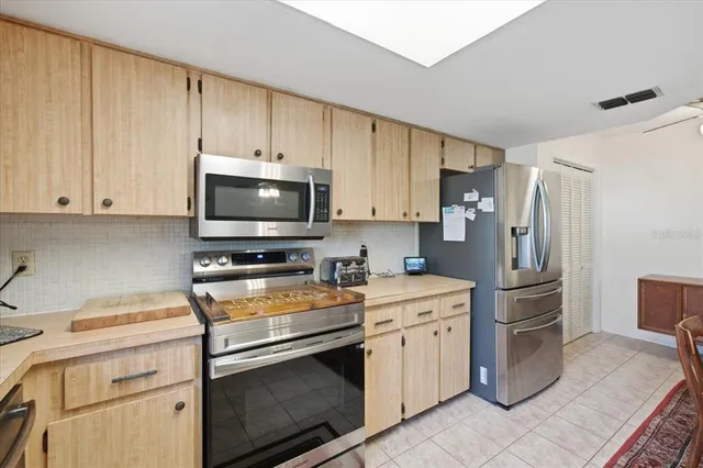 a kitchen with a stove microwave and refrigerator