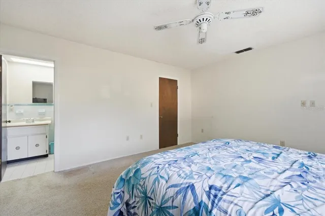 a bedroom with a bed and a cabinets