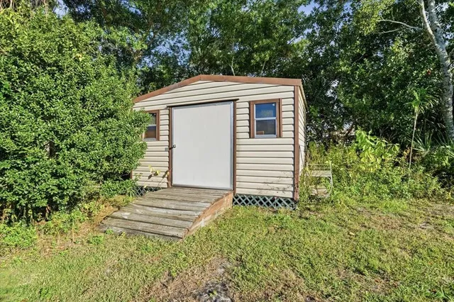 a backyard of a house with lots of green space