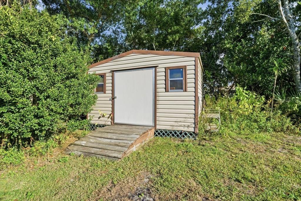 12439 Hanley Drive Spring Hill, FL 34608 - Photo 35 of 36 a backyard of a house with lots of green space