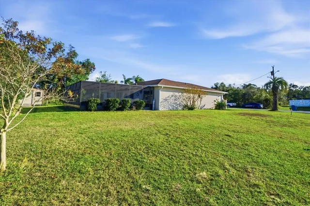 a view of a house with a yard