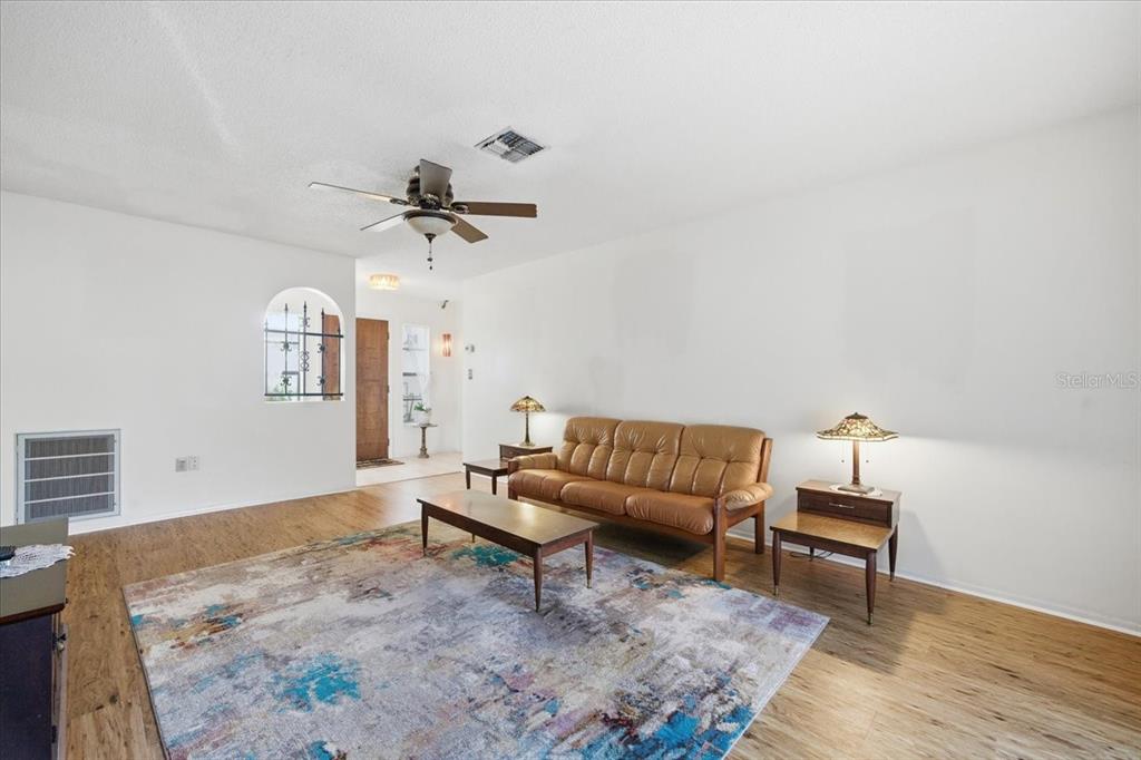 12439 Hanley Drive Spring Hill, FL 34608 - Photo 5 of 36 a living room with furniture