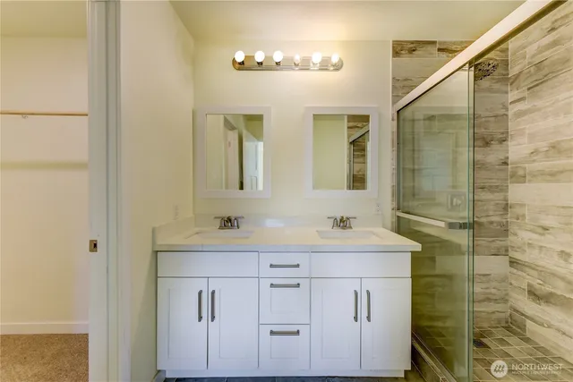 a bathroom with a sink a vanity and a mirror
