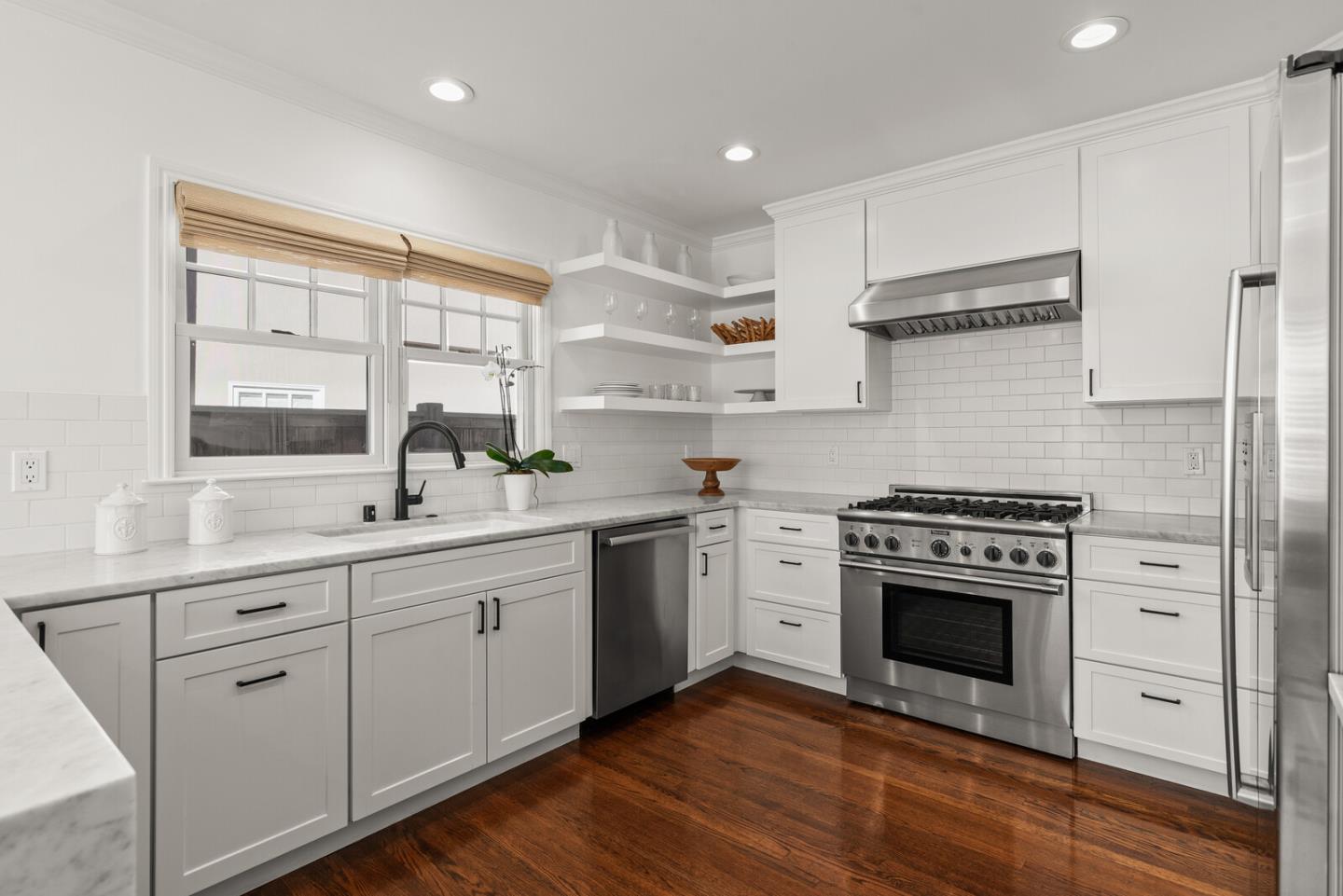 1350 Johnson Street Menlo Park, CA 94025 - Photo 11 of 30 a kitchen with white cabinets stainless steel appliances and sink