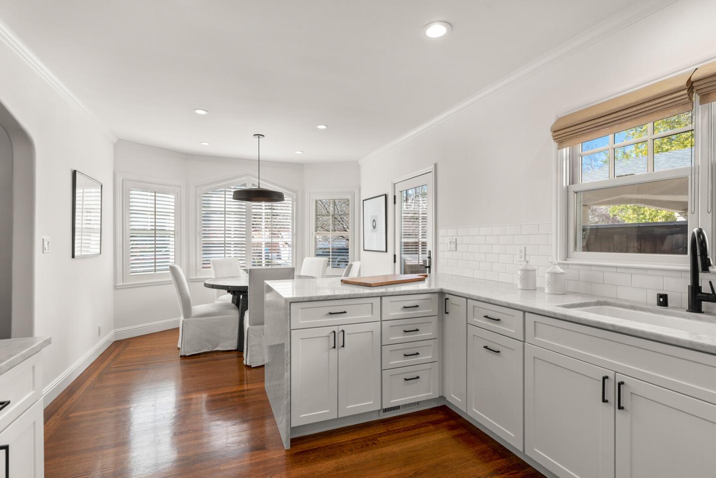 1350 Johnson Street Menlo Park, CA 94025 - Photo 13 of 30 a kitchen with sink cabinets and wooden floor