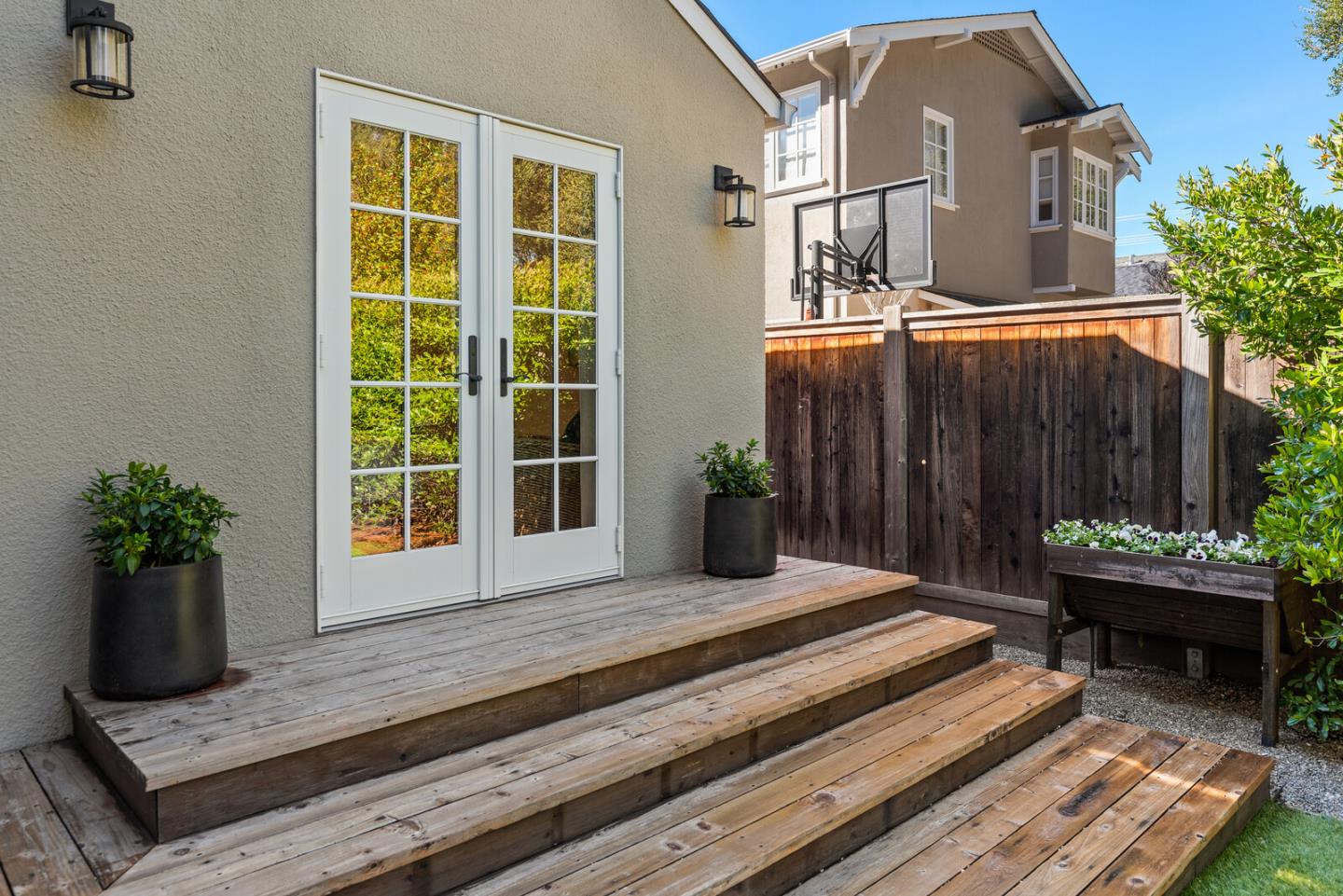 1350 Johnson Street Menlo Park, CA 94025 - Photo 22 of 30 a house with a bench next to a yard