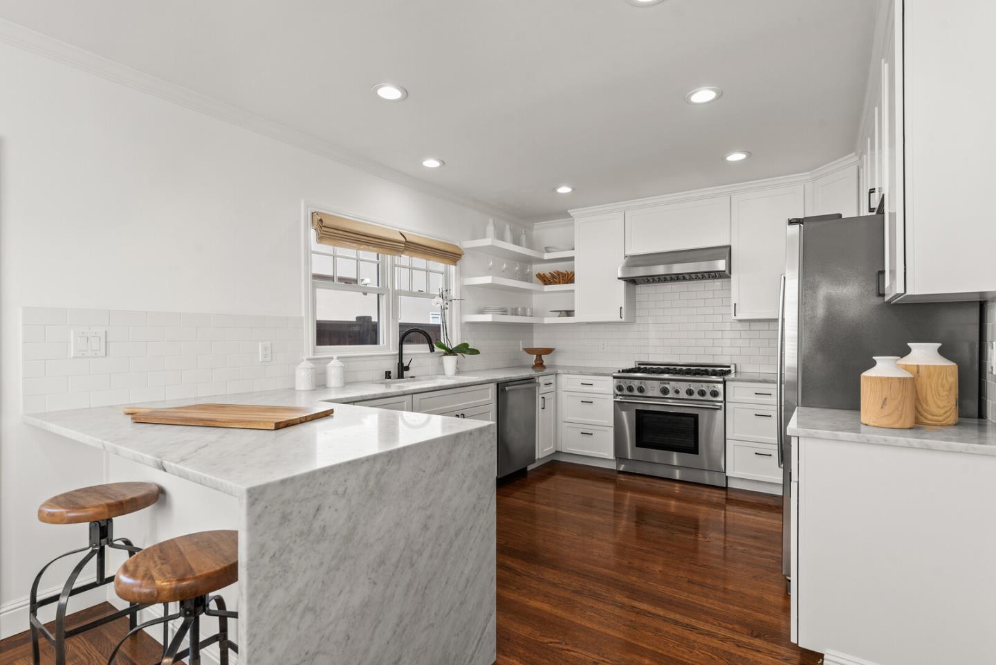 1350 Johnson Street Menlo Park, CA 94025 - Photo 10 of 30 a kitchen with stainless steel appliances granite countertop a stove top oven a sink a refrigerator and white cabinets with wooden floor