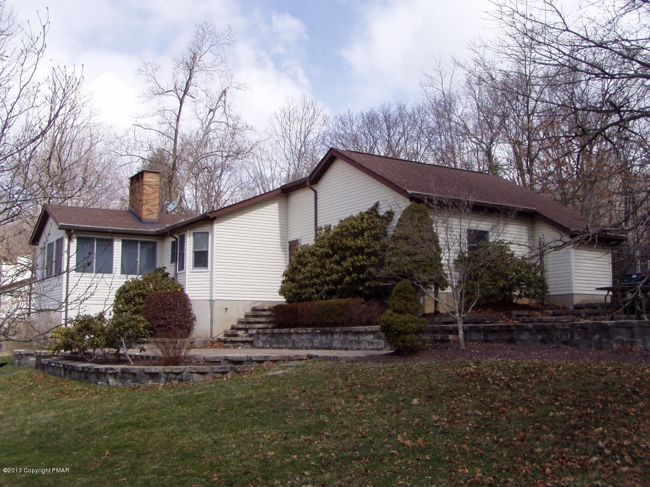 5 Orchard Road Swiftwater, PA 18370 - Photo 6 of 26 a front view of a house with garden
