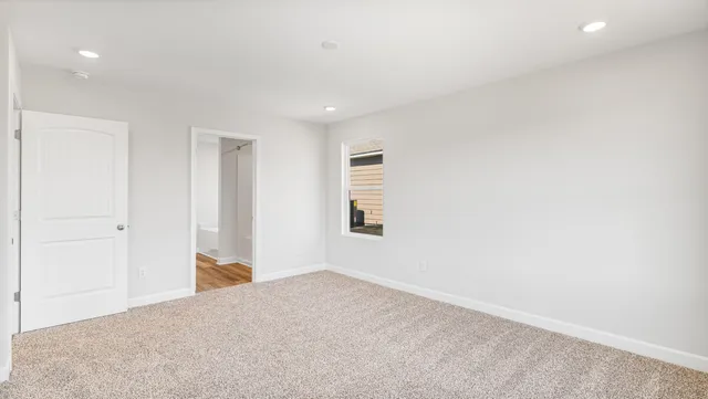 a view of an empty room and window