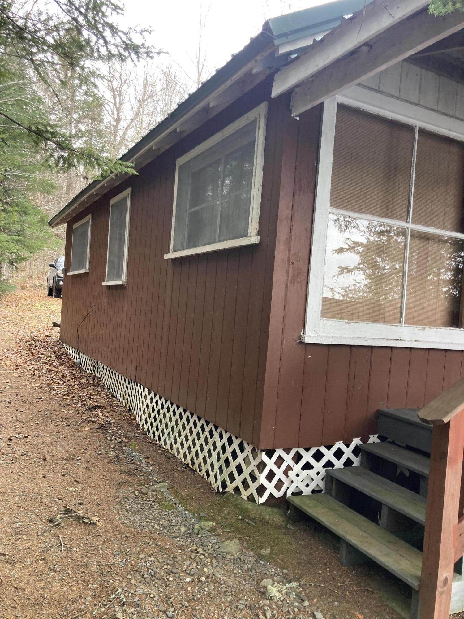 999 Presque Isle Lake Road Bridgewater, ME 04735 - Photo 2 of 23 side of camp