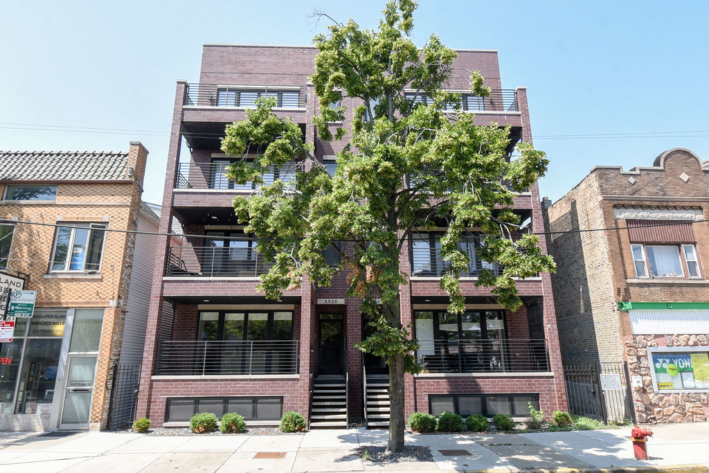 a front view of a building with street view