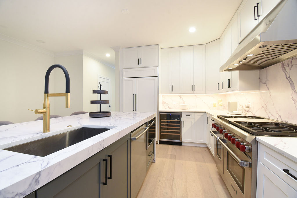 Undisclosed Address Chicago, IL 60613 - Photo 13 of 50 a kitchen that has a sink and a stove