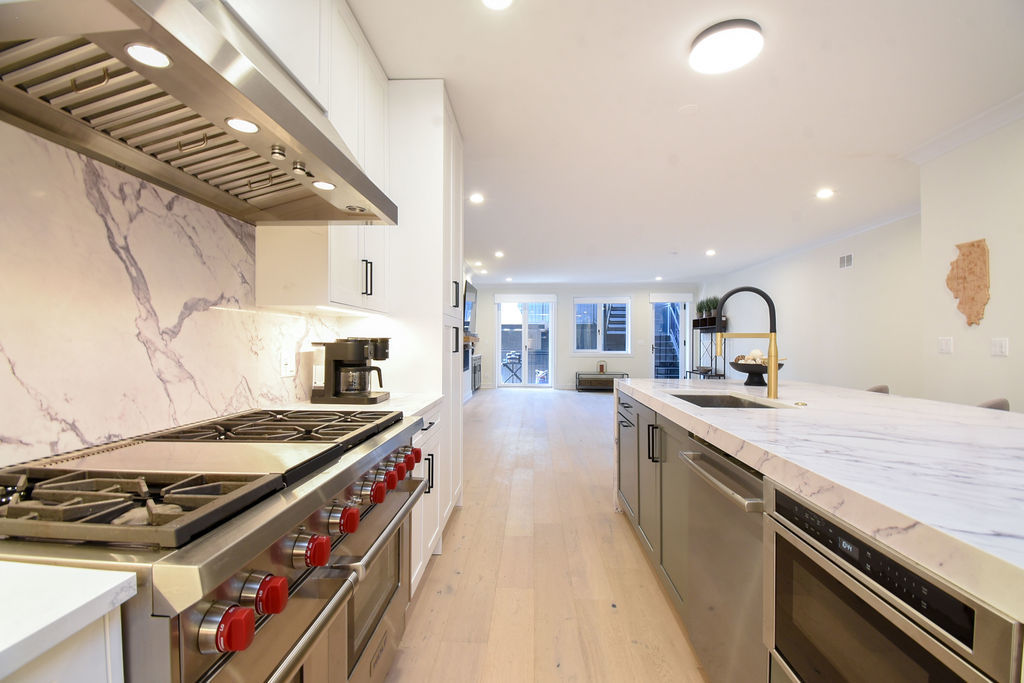 Undisclosed Address Chicago, IL 60613 - Photo 14 of 50 a kitchen with a stove and a sink