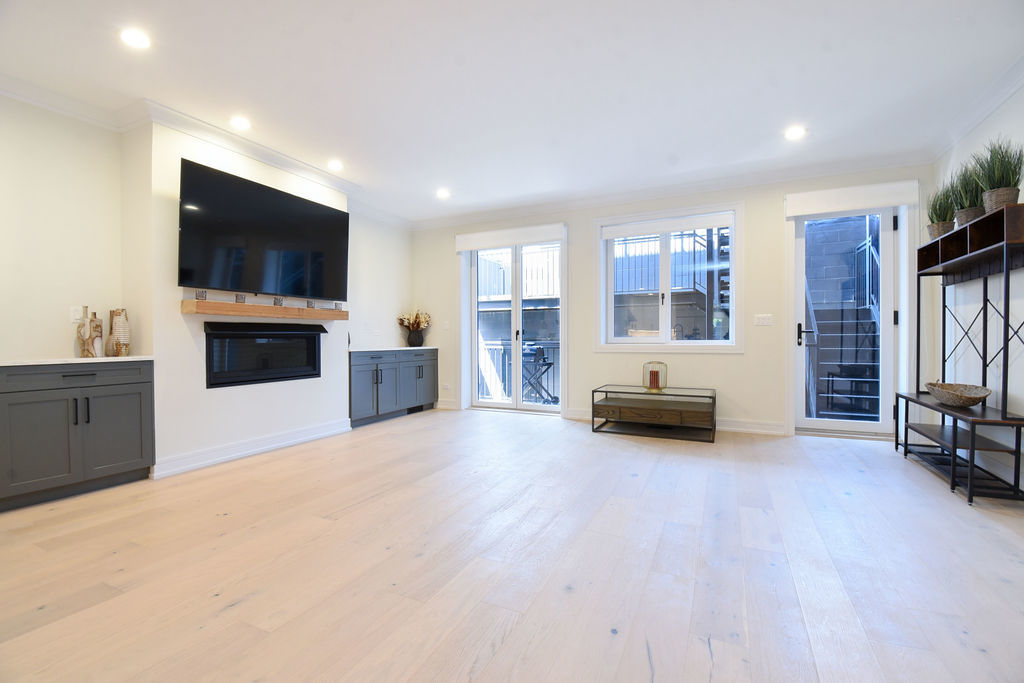 Undisclosed Address Chicago, IL 60613 - Photo 16 of 50 a living room with furniture and a flat screen tv