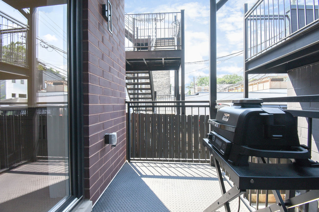 Undisclosed Address Chicago, IL 60613 - Photo 19 of 50 a view of a balcony with a door
