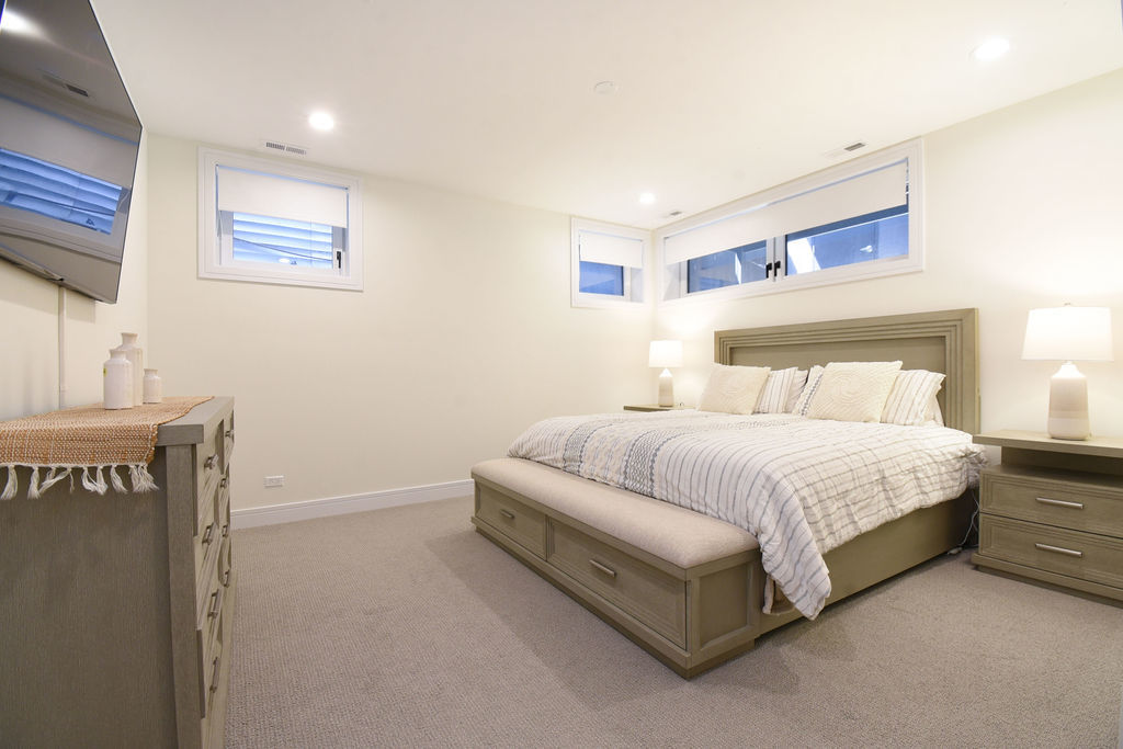 Undisclosed Address Chicago, IL 60613 - Photo 35 of 50 a bedroom with a bed and a night stand