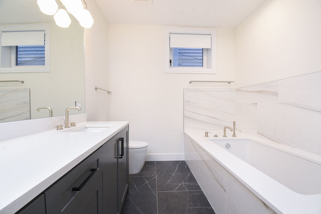 Undisclosed Address Chicago, IL 60613 - Photo 39 of 50 a bathroom with a sink a toilet and bathtub