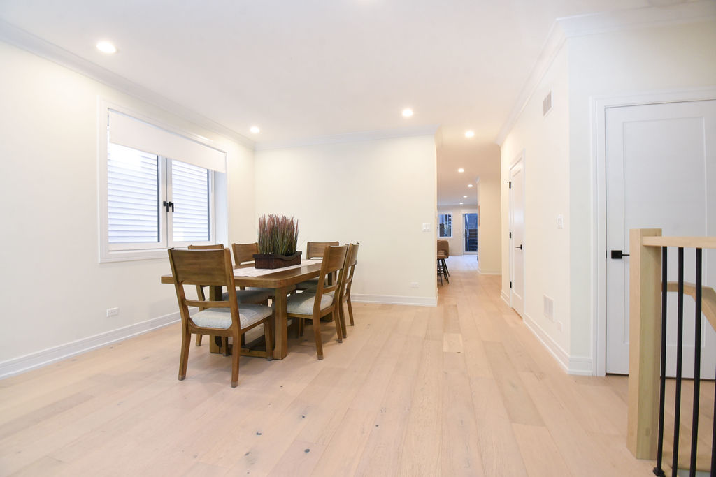 Undisclosed Address Chicago, IL 60613 - Photo 7 of 50 a view of a dining room with furniture