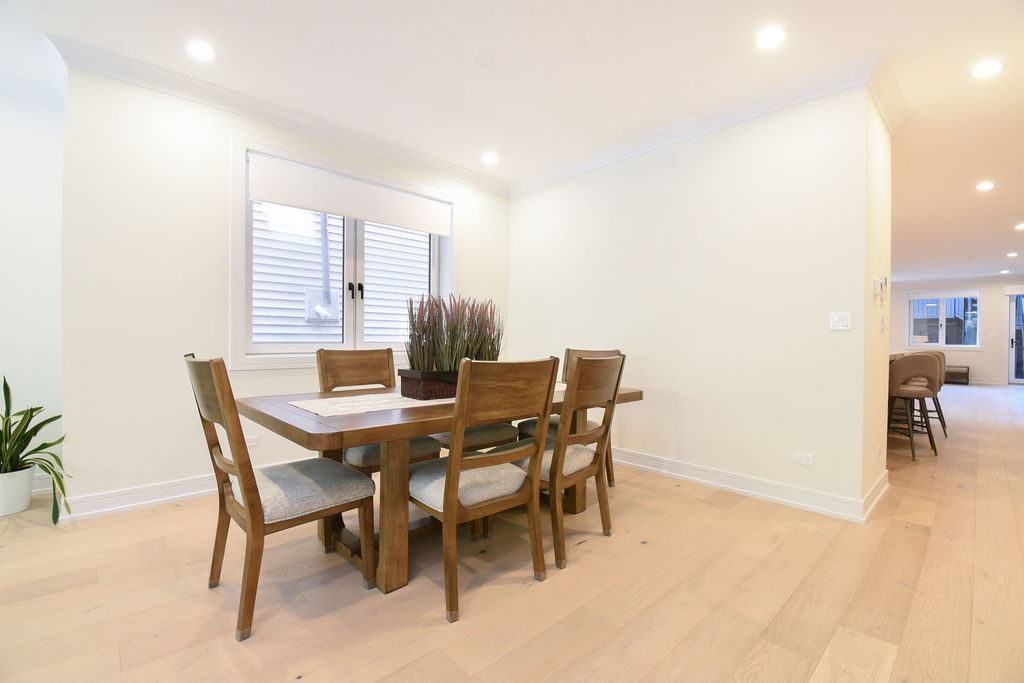 Undisclosed Address Chicago, IL 60613 - Photo 8 of 50 a view of a dining room with furniture