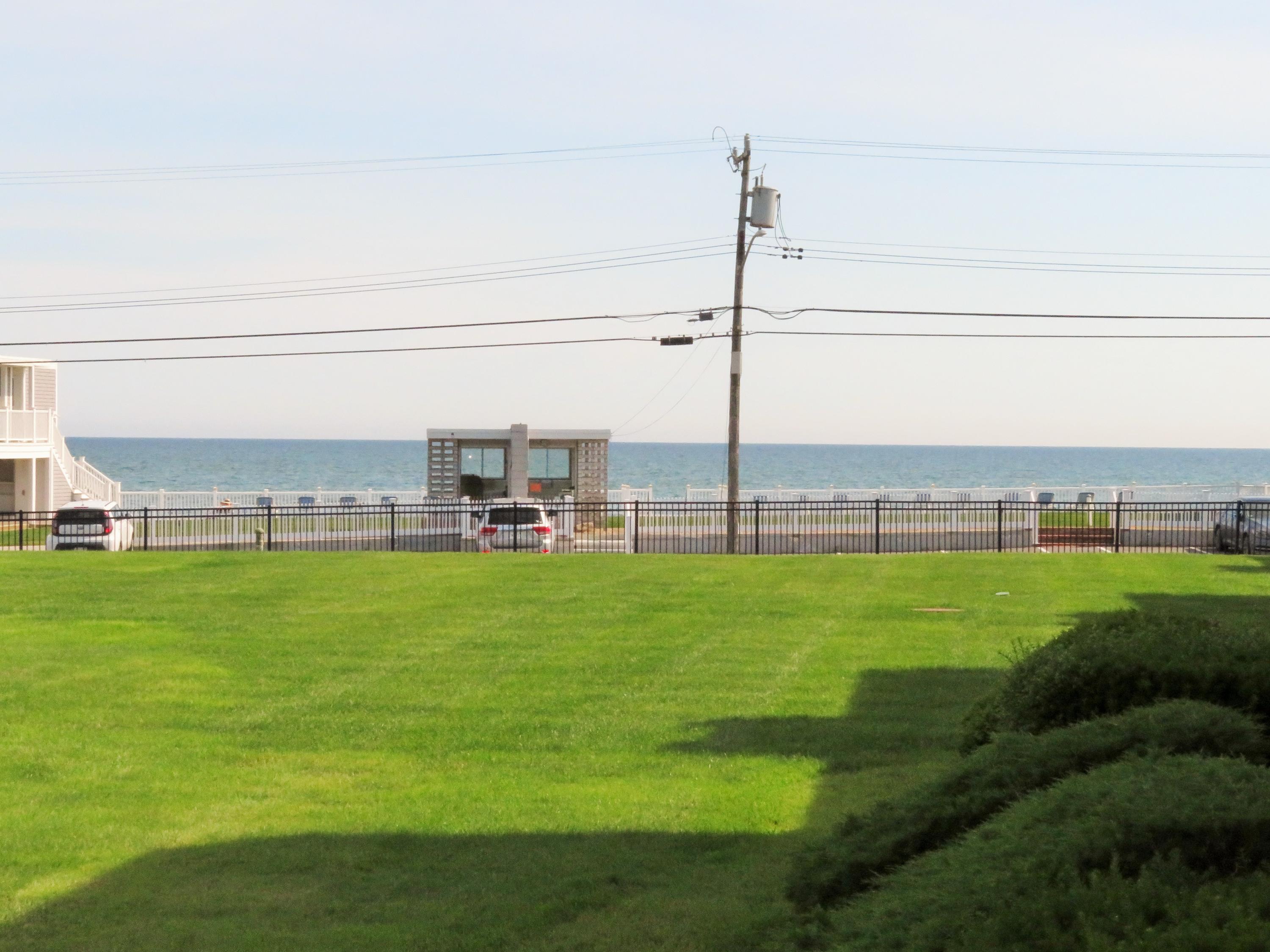 112 Old Wharf Road, Unit W9 Dennis Port, MA 02639 - Photo 1 of 19 a view of a garden with lawn chairs