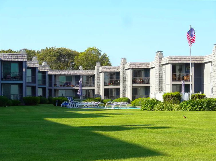 112 Old Wharf Road, Unit W9 Dennis Port, MA 02639 - Photo 18 of 19 a front view of a house with a garden