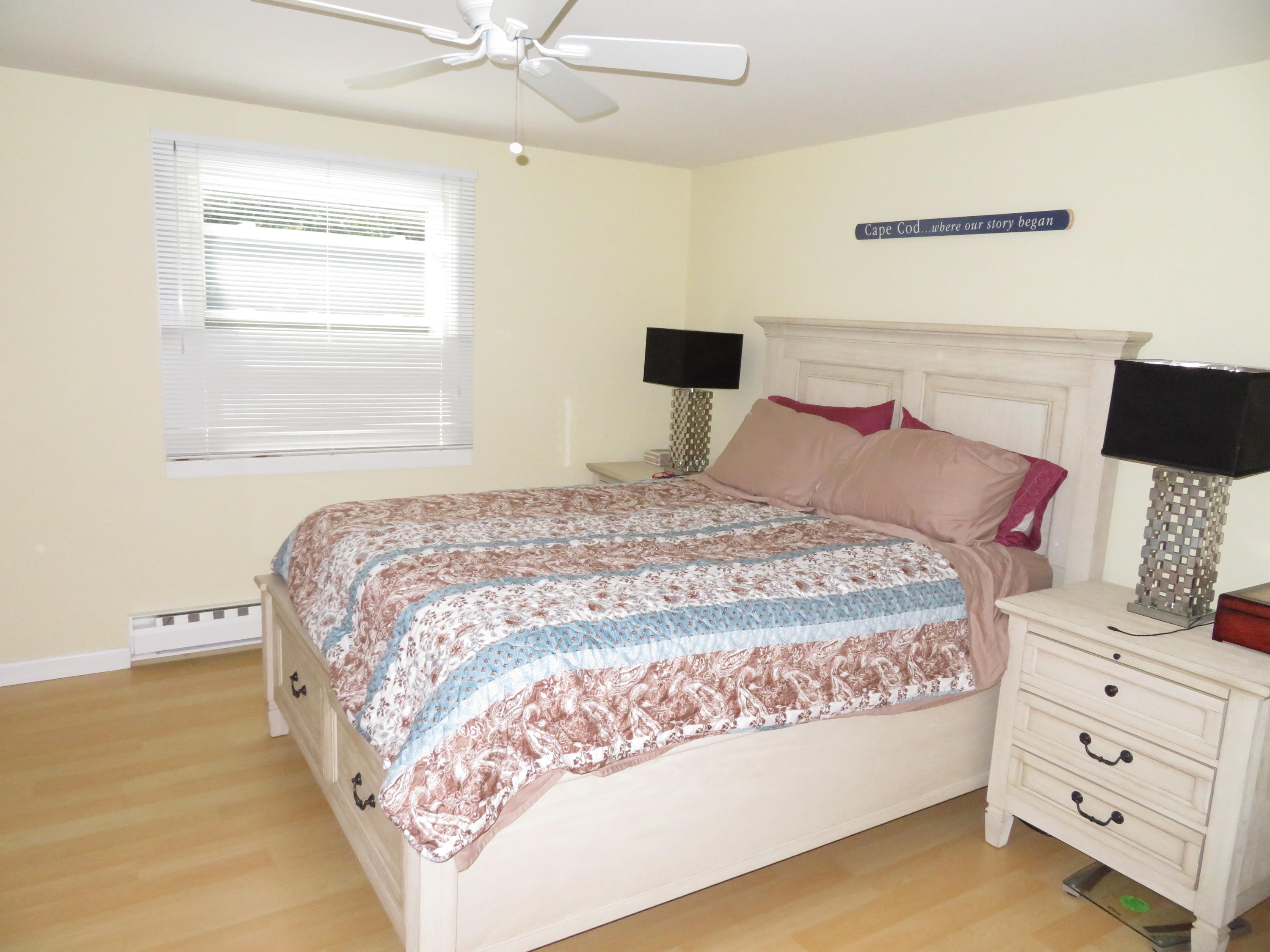 112 Old Wharf Road, Unit W9 Dennis Port, MA 02639 - Photo 6 of 19 a bedroom with a bed and a window