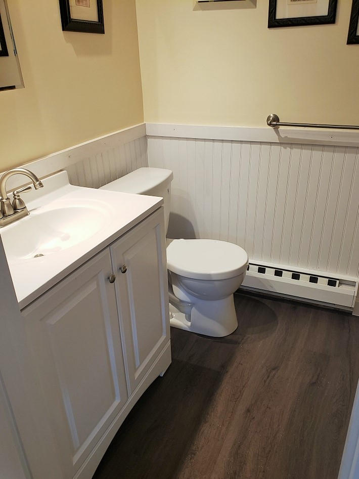 112 Old Wharf Road, Unit W9 Dennis Port, MA 02639 - Photo 7 of 19 a bathroom with a sink a toilet and vanity