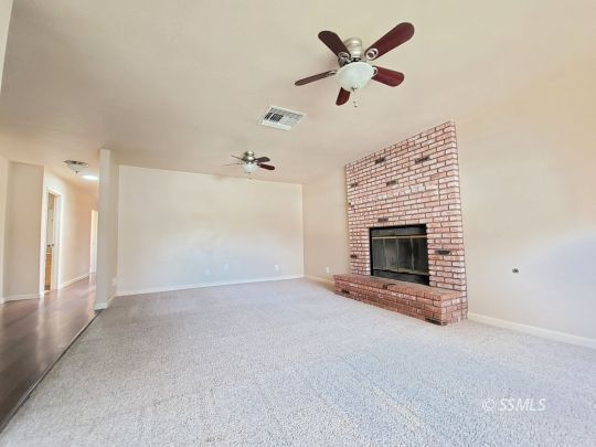 616 South Appaloosa Street Ridgecrest, CA 93555 - Photo 4 of 18 an empty room with fan and windows