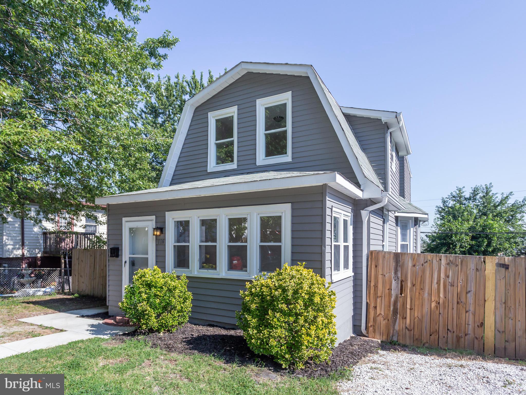 110 West Hilltop Road Baltimore, MD 21225 - Photo 1 of 30 a front view of a house with garden