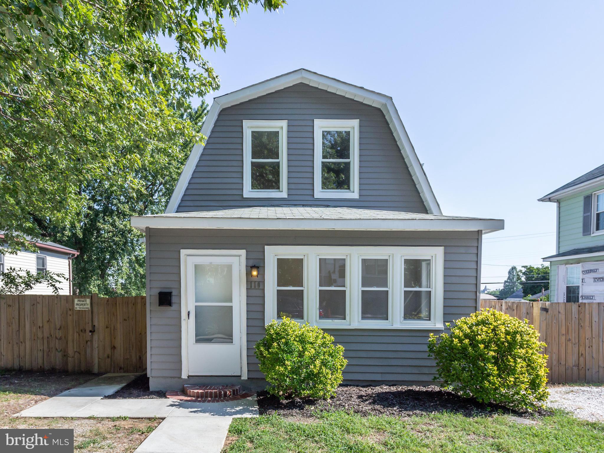 110 West Hilltop Road Baltimore, MD 21225 - Photo 2 of 30 a front view of a house with garden