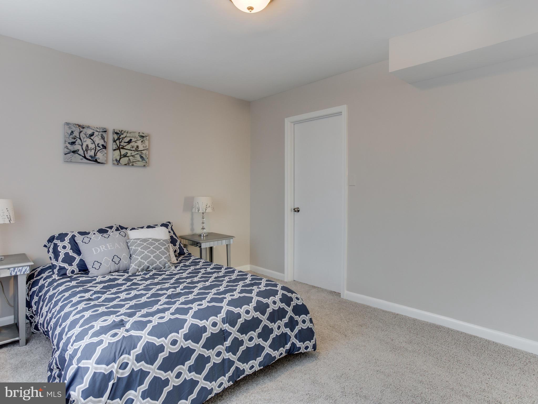 110 West Hilltop Road Baltimore, MD 21225 - Photo 18 of 30 a bedroom with a bed and a window