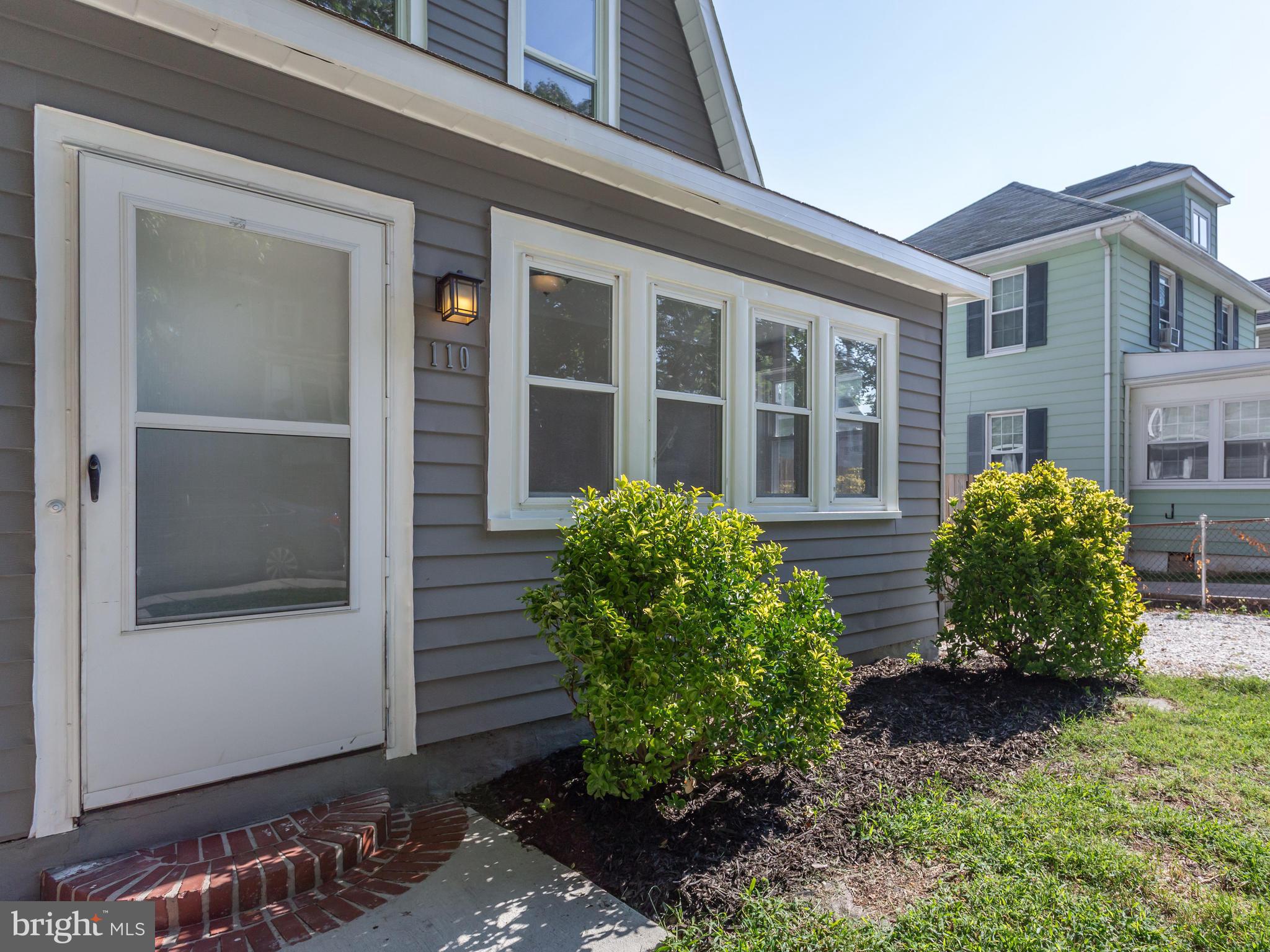 110 West Hilltop Road Baltimore, MD 21225 - Photo 3 of 30 a front view of a house with garden