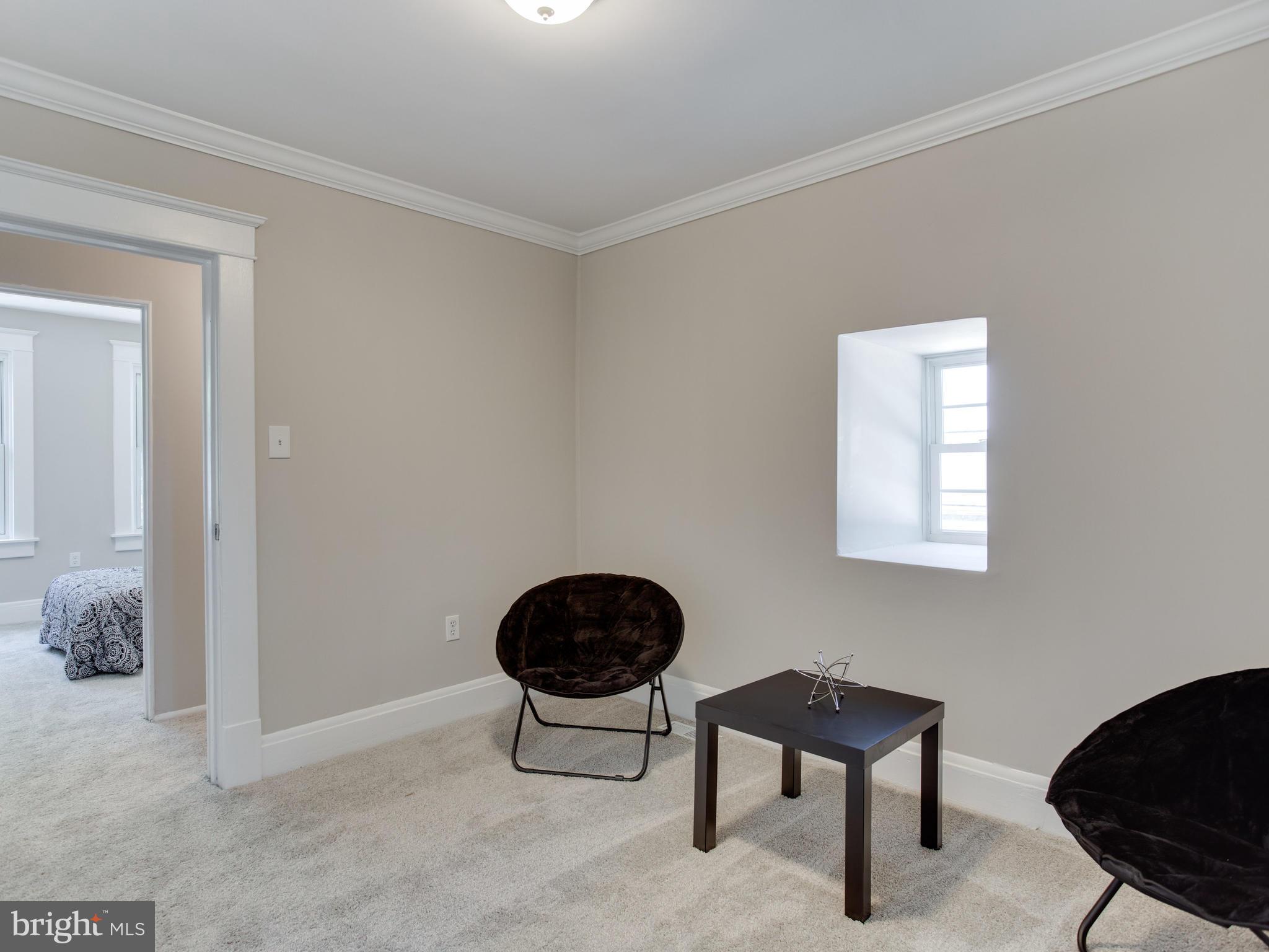 110 West Hilltop Road Baltimore, MD 21225 - Photo 22 of 30 a view of a livingroom with furniture and a window