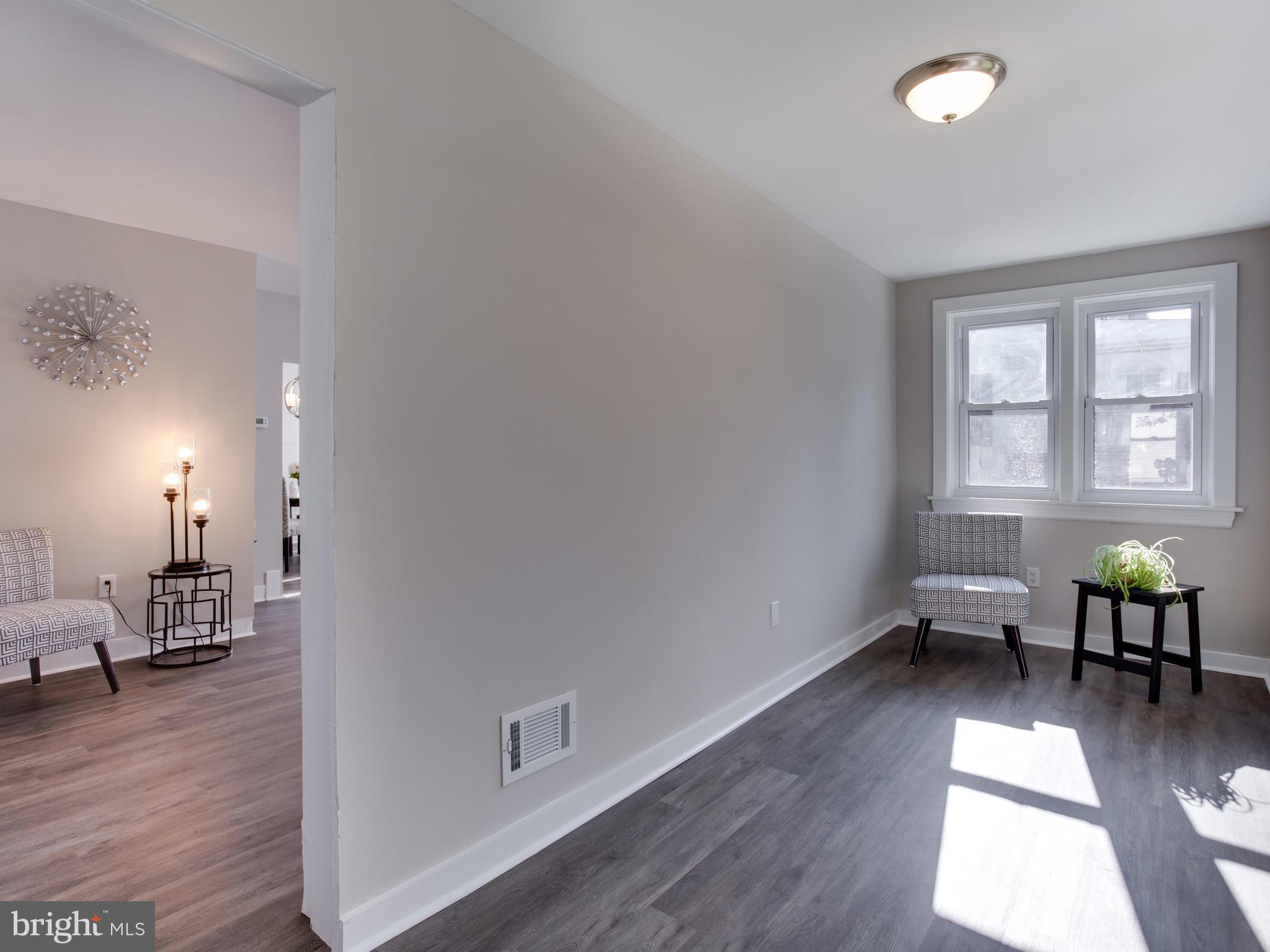 110 West Hilltop Road Baltimore, MD 21225 - Photo 5 of 30 a view of a livingroom with furniture and a window