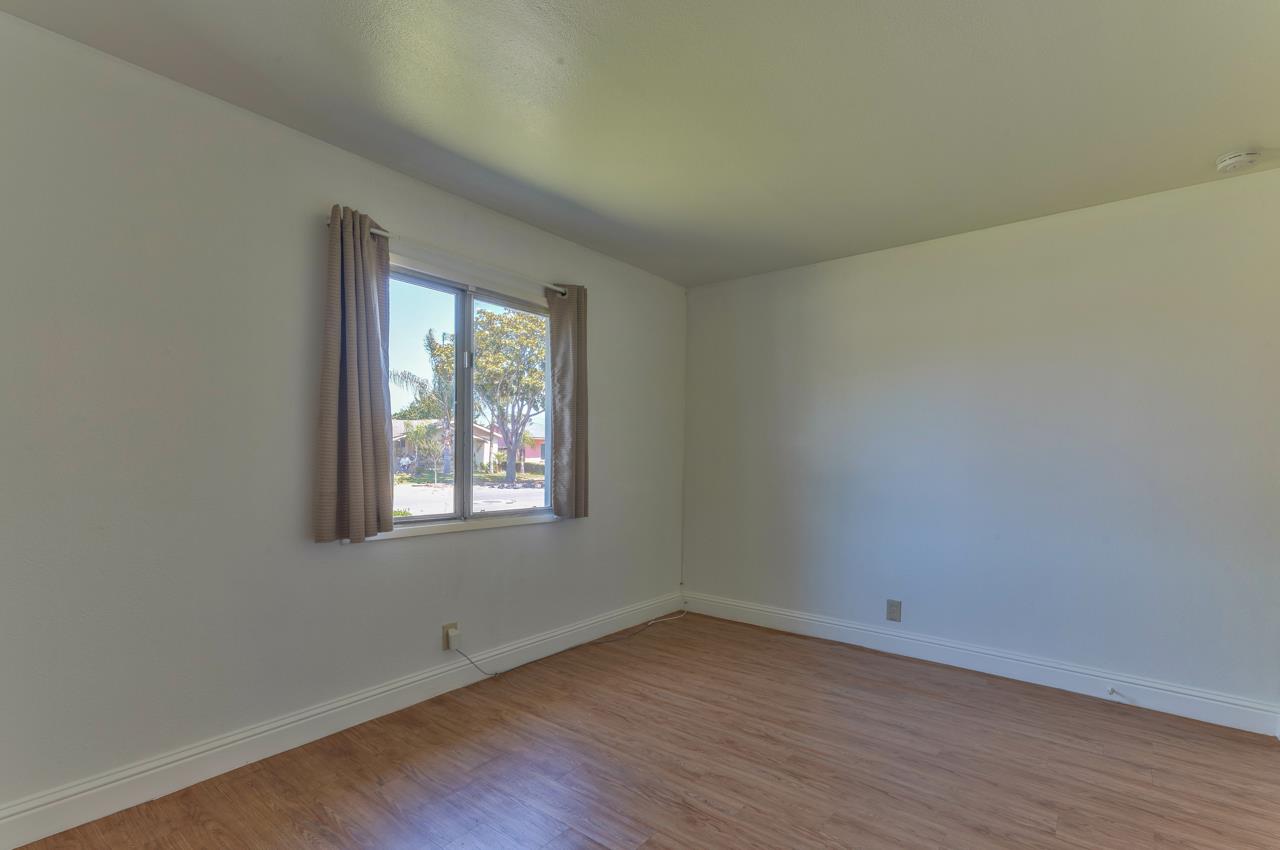 736 Sausal Drive Salinas, CA 93906 - Photo 12 of 24 an empty room with wooden floor and windows