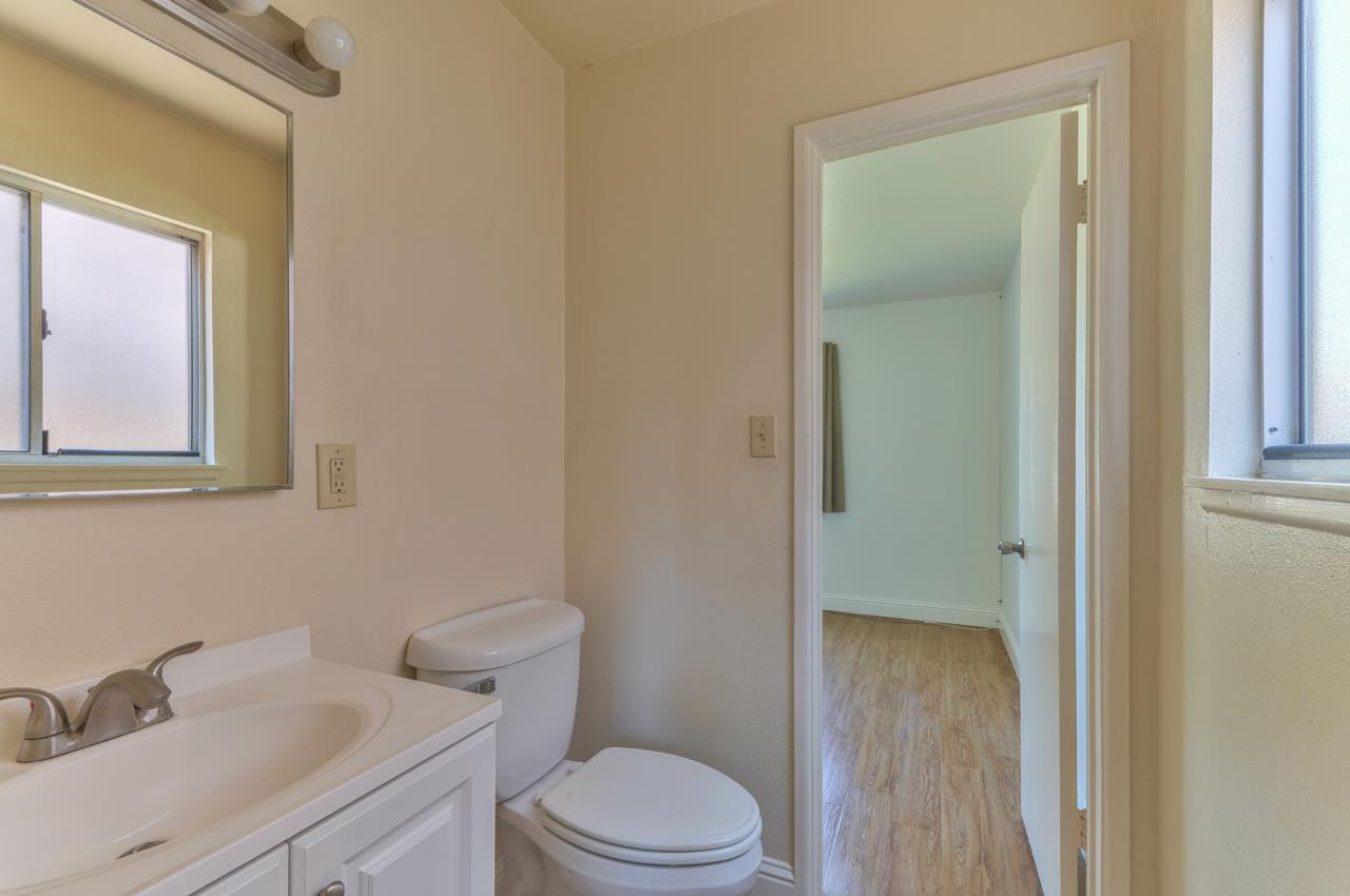 736 Sausal Drive Salinas, CA 93906 - Photo 14 of 24 a white toilet sitting next to a bathroom sink