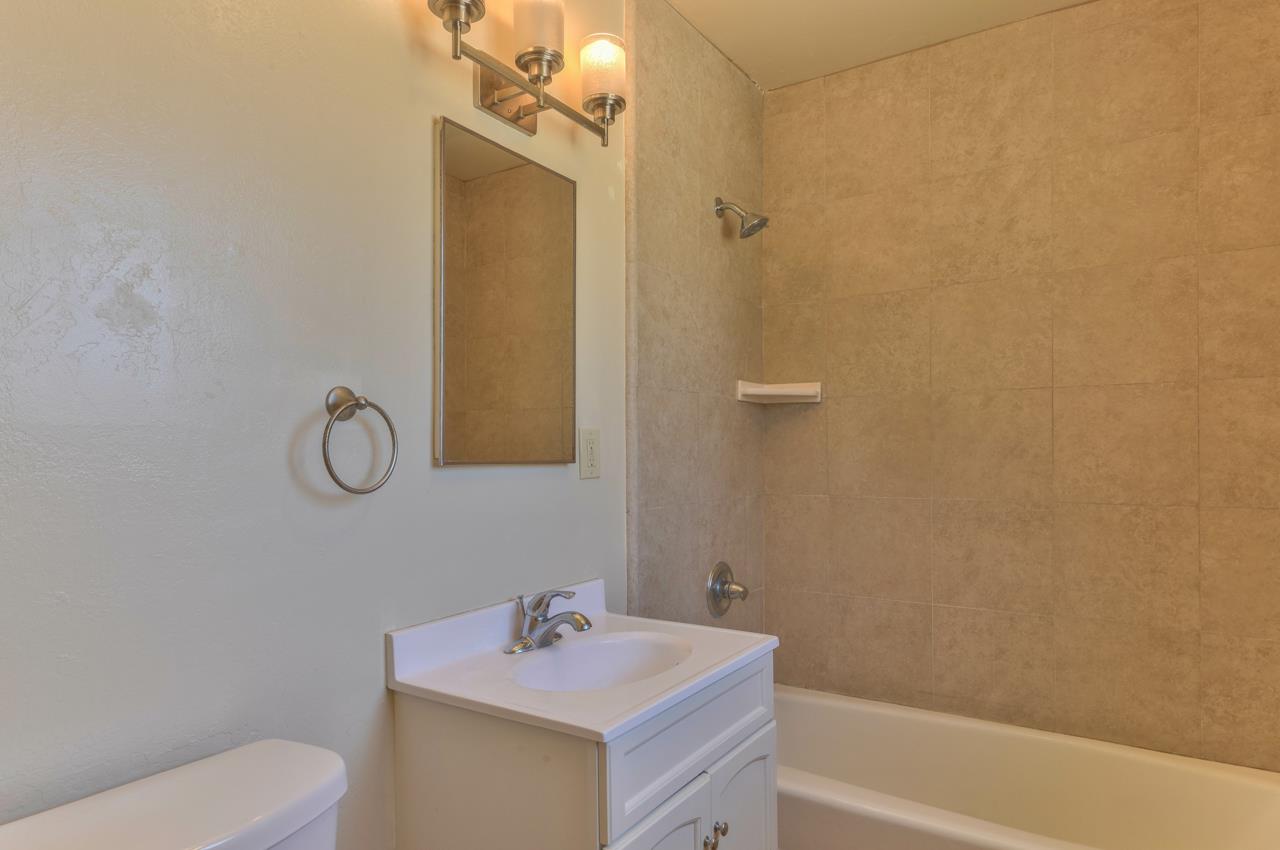 736 Sausal Drive Salinas, CA 93906 - Photo 19 of 24 a bathroom with a sink toilet and vanity