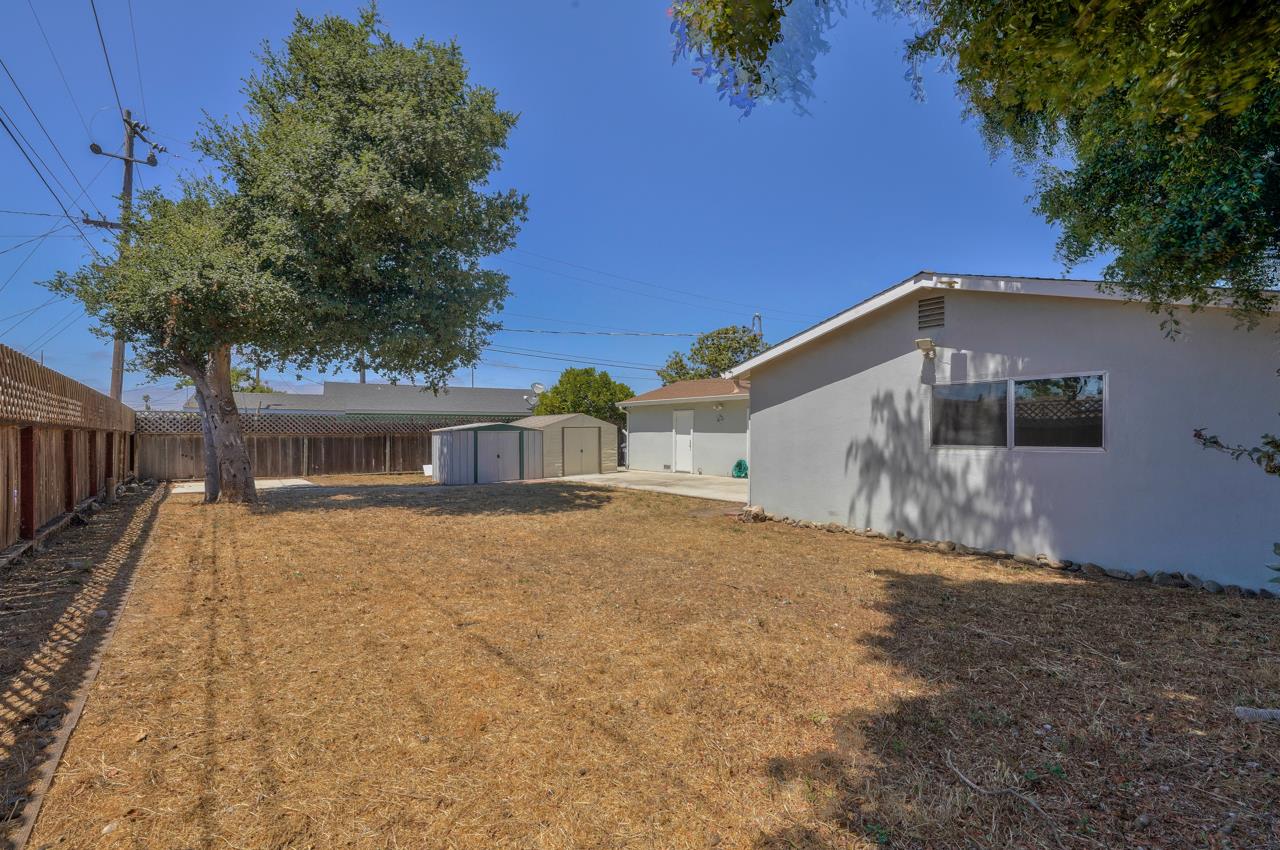 736 Sausal Drive Salinas, CA 93906 - Photo 23 of 24 a yellow house with trees in front of it