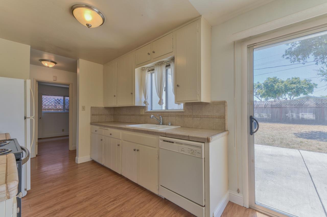 736 Sausal Drive Salinas, CA 93906 - Photo 10 of 24 a bathroom with a granite countertop sink a mirror and a shower