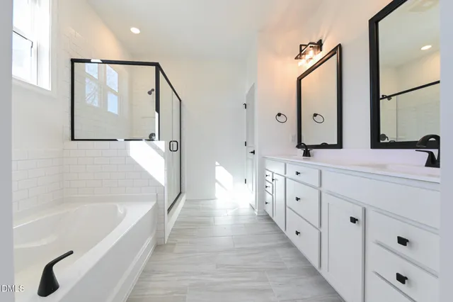 a close up of a bathtub with a shower
