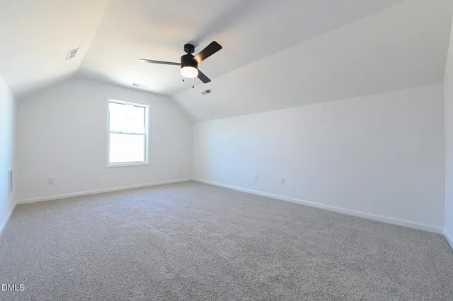a view of a balcony with wooden floor