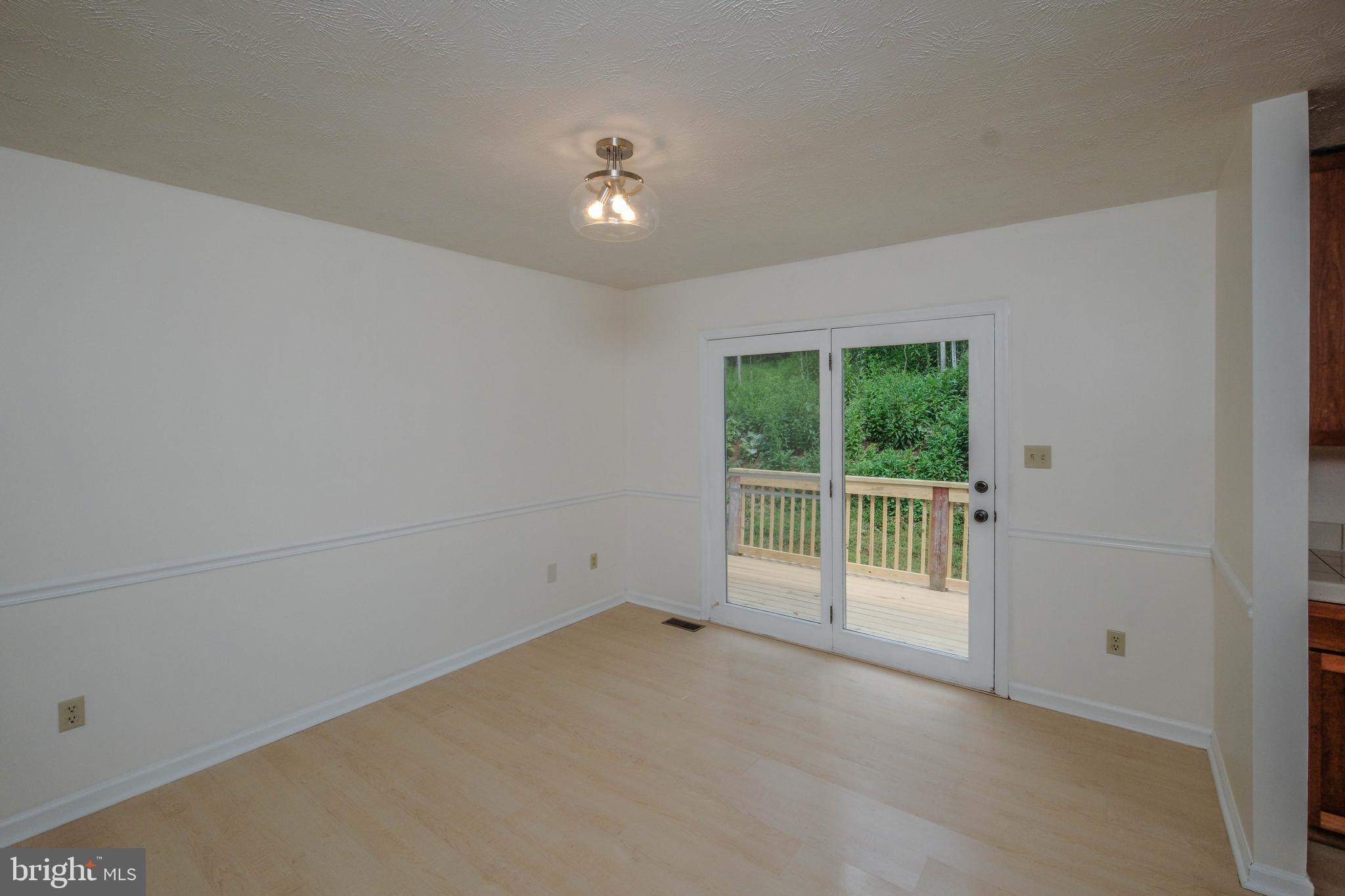 22 Wealthy Road Linden, VA 22642 - Photo 16 of 92 Dining area off kitchen has chair railing