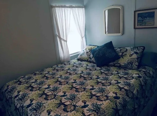 a bathroom with a toilet a sink and shower