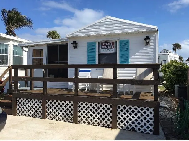 a view of a chairs and table in patio