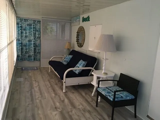 a living room with furniture and a window