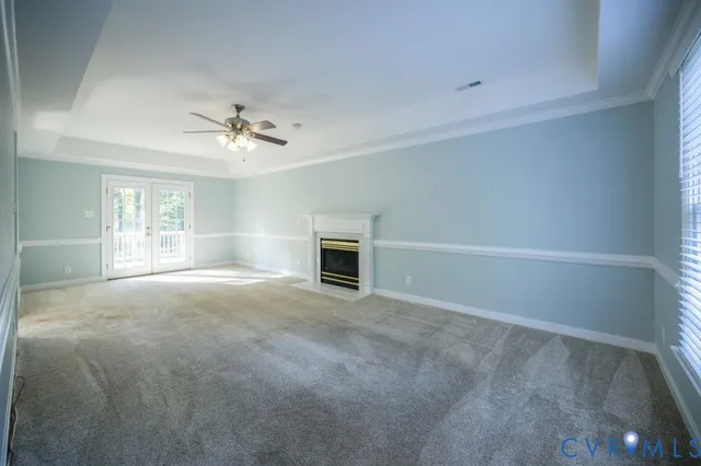 a view of an empty room with a fireplace