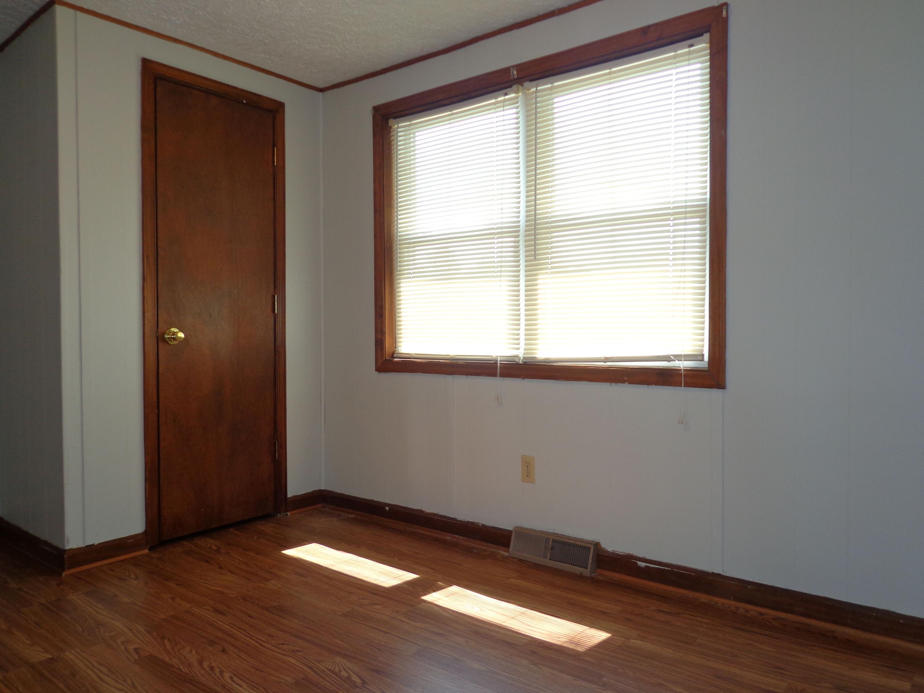 550 Hopkins Road Rocky Mount, VA 24151 - Photo 14 of 17 a view of an empty room with wooden floor and a window