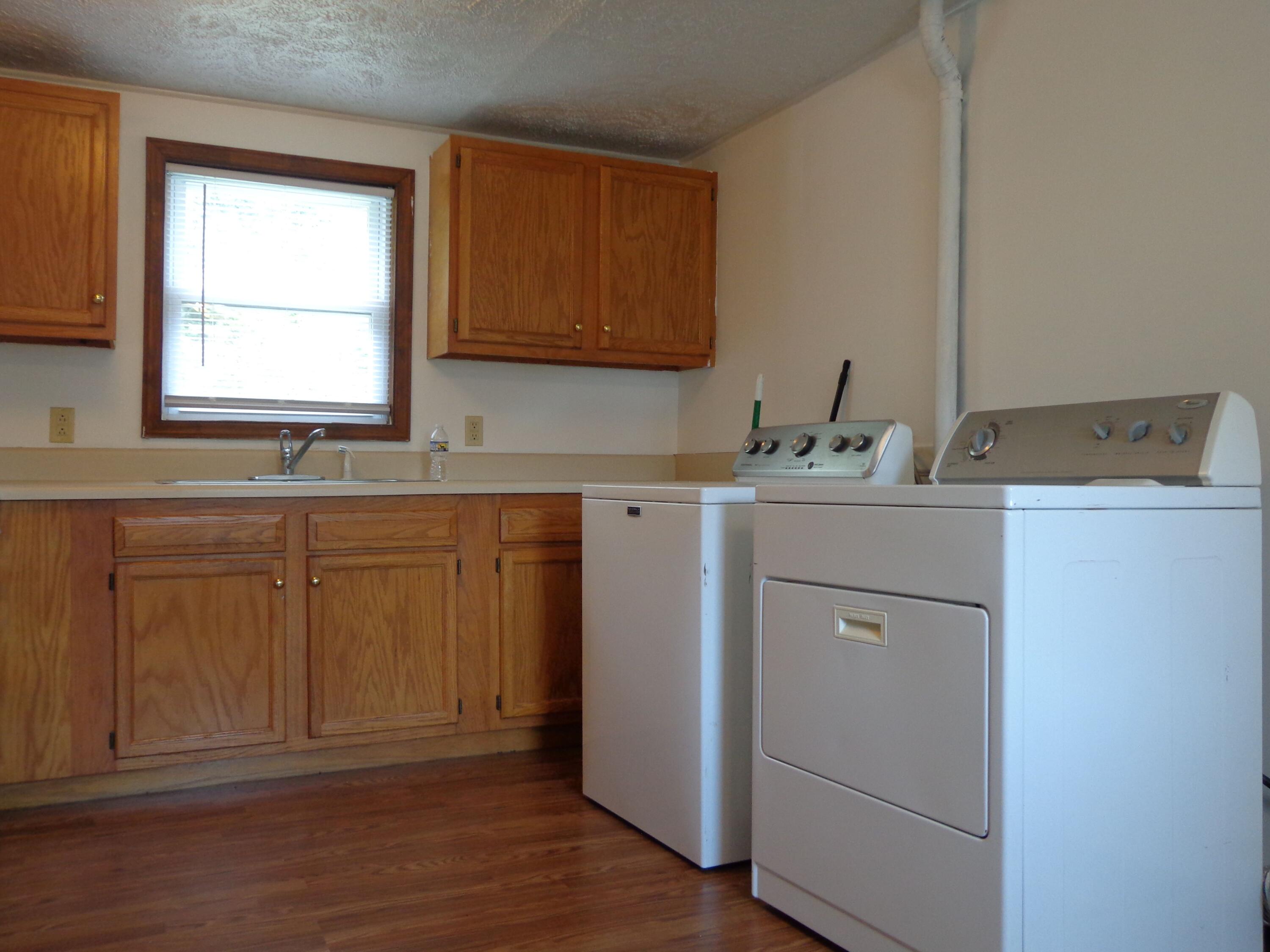 550 Hopkins Road Rocky Mount, VA 24151 - Photo 9 of 17 a view of cabinets a sink and a window in a room