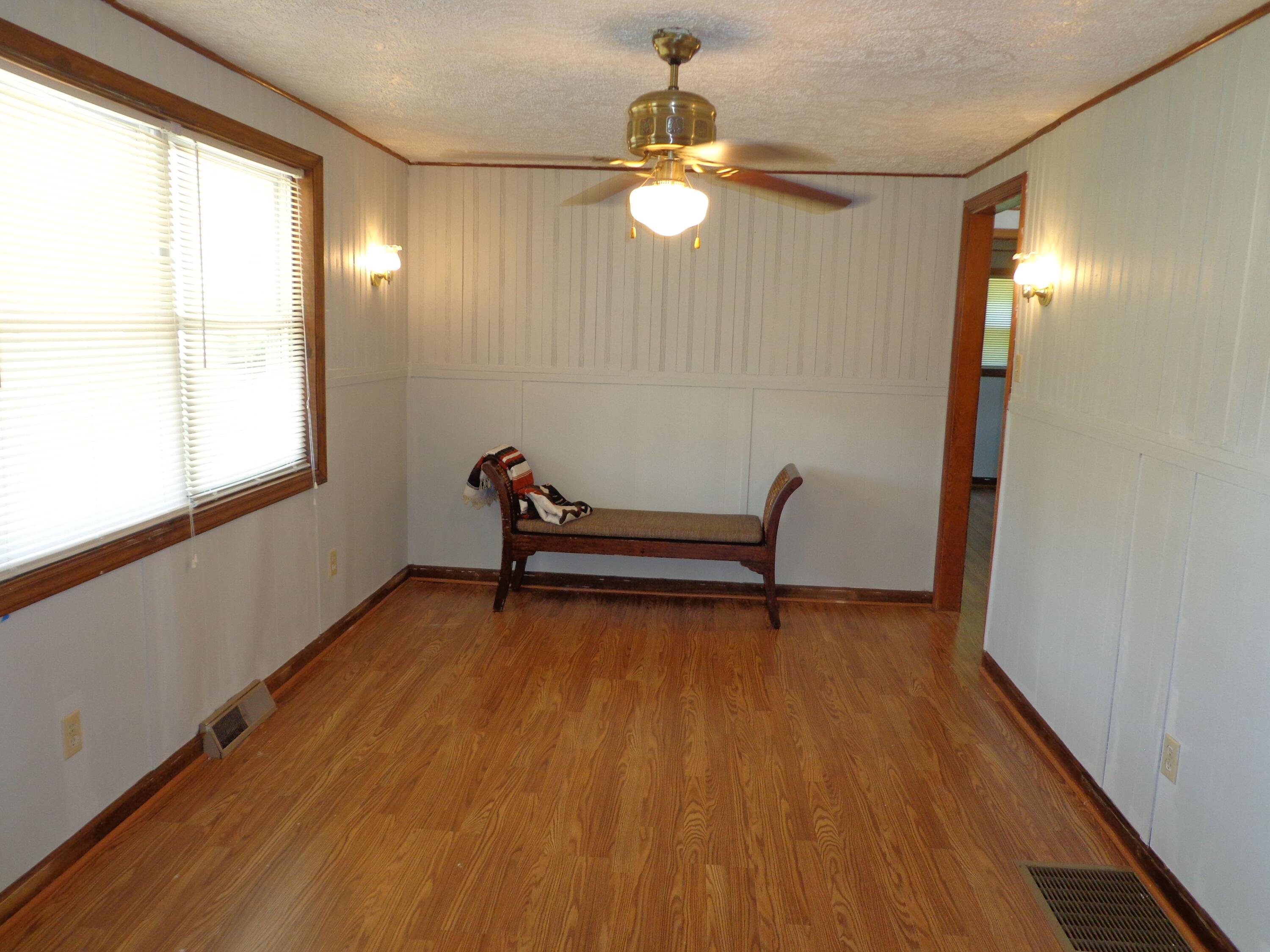 550 Hopkins Road Rocky Mount, VA 24151 - Photo 10 of 17 a view of room with lounge chair and windows